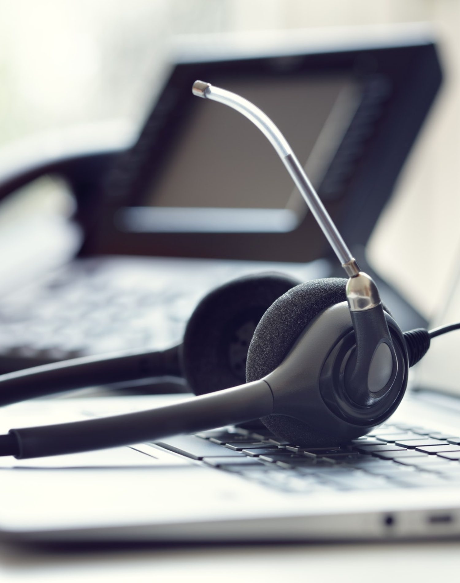 headset-headphones-telephone-and-laptop-in-call-center.jpg